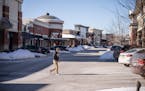 Shoppers walked outside of stores at the Woodbury Lakes shopping center on Thursday , Feb. 3, 2023 in Woodbury, Minn. 