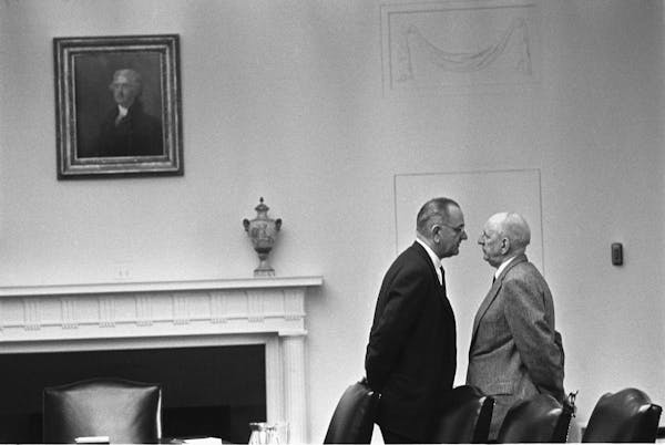Lyndon B. Johnson meets with Sen. Richard Russell in December 1963.