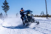 Professional snowmobile racer David Fischer of the Twin Cities aboard his 2023 Polaris 850 Patriot Boost Assault. Fischer is among the experts who agr