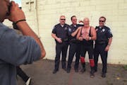 Kenny “The Sodbuster” Jay posed for photos in 1998 with officers who adored the wrestler in West St. Paul.