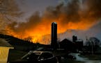 A train fire is seen from Melissa Smith’s farm in East Palestine, Ohio, Friday, Feb. 3, 2023. 