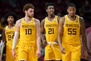 Minnesota Gophers players return to the court, down nearly 40 points, after a timeout against the Maryland Terrapins during the second half of an NCAA