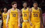 Minnesota Gophers players return to the court, down nearly 40 points, after a timeout against the Maryland Terrapins during the second half of an NCAA