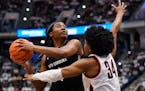 South Carolina’s Aliyah Boston looked to shoot as UConn’s Ayanna Patterson defended Sunday. Boston scored 23 of her 26 points in the second half a