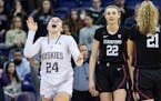Washington guard Elle Ladine, left, enjoyed the final few seconds of the Huskies’ 72-67 upset of Cameron Brink (22) and No. 2 Stanford on Sunday.