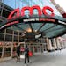 FILE - People walk by the AMC 34th Street theater on March 5, 2021, in New York. AMC Theaters, the nation’s largest movie theater chain, on Monday u