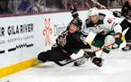 Wild defenseman Jared Spurgeon battled for the puck with Coyotes center Barrett Hayton in the first period.