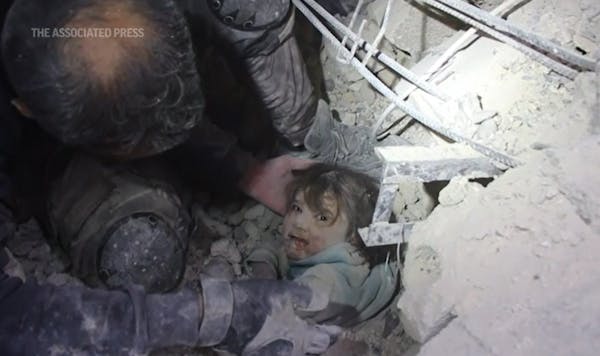 Child rescued from rubble after quake in Syria
