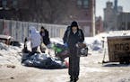 The Minnesota Department of Transportation clears and vacates the homeless encampment at East Lake Street and Hiawatha Avenue in Minneapolis on Tuesda
