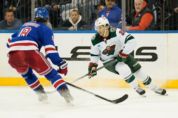Ryan Hartman, right, will likely move up to center the Wild’s first line after a season delayed by injury.