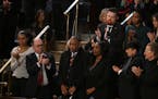 RowVaughn and Rodney Wells of Memphis, Tenn., the mother and stepfather of Tyre Nichols, stand as President Joe Biden recognizes them as he delivers t