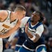 Nuggets center Nikola Jokic was defended by Timberwolves center Naz Reid in the first half Tuesday. Jokic finished with a triple-double of 20 points, 