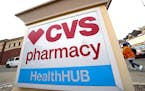 A CVS store sign is displayed in Pittsburgh on Friday, Feb. 3, 2023. CVS Health is plunging deeper into primary care services, buying Oak Street Healt