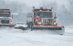 A trio of snowplows cleared ramps along I-35 in Lakeville on Tuesday, Feb. 22, 2022.