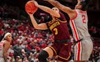 Freshman guard Amaya Battle tried to get off a shot during the Gophers’ 93-63 loss to No. 13 Ohio State in Columbus, Ohio, on Wednesday night.
