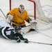 Gophers goalie Justen Close, above vs. Michigan State in late January, is a key to the team’s NCAA playoff run.