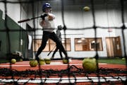 Roosevelt High School student Greta Prem, 16, took batting practice with 612 Fastpitch at MSA Sports Academy in Bloomington. Generations of city girls