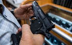 A customer checked out a handgun for sale in Hempstead, N.Y., in June 2022. 