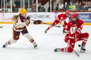 Gophers captain Abigail Boreen took a shot that was defended by Wisconsin’s Vivian Jungels, an Edina native, when the teams met Feb. 10 at Ridder Ar