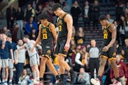 Gophers players Jaden Henley (13), Dawson Garcia (3) and Pharrel Payne (21) walked off the court after a loss to Penn State on Feb. 18 at Williams Are