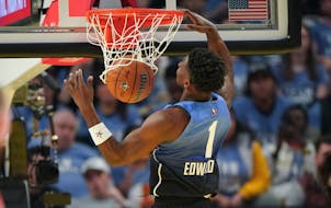 Team LeBron guard Anthony Edwards (1) dunks during the first half of the NBA basketball All-Star game Sunday.