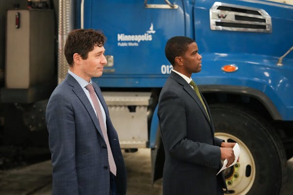 Public officials including Minneapolis Mayor Jacob Frey, left, and St. Paul Mayor Melvin Carter hold a joint press conference before an anticipated hi