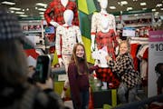 Nicole Leary of Edina took a photo of her daughter Sloane, right, and niece Teagan Swanson as they posed with a mannequin of Target mascot Bullseye du