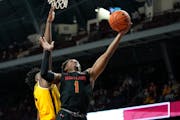 Gophers forward Joshua Ola-Joseph defended Maryland guard Jahmir Young (1) when the teams met Feb. 4 at Williams Arena.