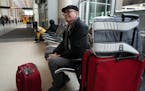 Pat Schleicher waits at MSP Airport’s Terminal 2 to board his flight home to Nevada, one of the few remaining flights that hadn’t been canceled, a