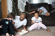 Deonté Haynes spent the day with his three younger children (from left) Alex, 8, and Jalei, 8, and Deonté Jr., 6, after he took the day off from wor