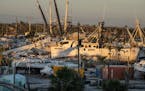The remains of boats in Fort Myers Beach, Fla., that were tossed around the shoreline by Hurricane Ian.