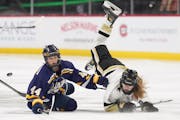 Rosemount’s Aubrey Finn (44) and Andover’s Ella Thoreson collided in the neutral zone in the first period Thursday.