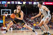 Gophers forward Jamison Battle stepped back to take a shot against Penn State guard Seth Lundy in last Saturday’s loss at Williams Arena.