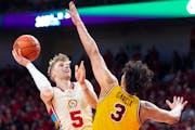 Nebraska’s Sam Griesel scores in the paint over Minnesota’s Dawson Garcia during the second half Saturday at Pinnacle Bank Arena in Lincoln, Neb.