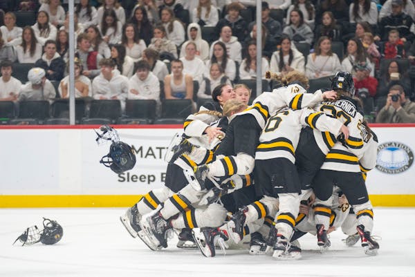 The Warroad players made it a group celebration after securing the Class 1A state title.