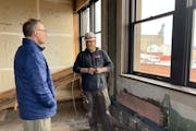 Kyle Klatt, left, Red Wing community development director, views progress on the old Goodhue County National Bank renovation with construction foreman