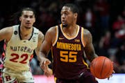 Guard Ta’Lon Cooper (55) and the Gophers took a 90-55 loss when they visited Rutgers on Feb. 1.