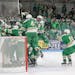 Edina’s players met at the net to enjoy their victory and the state berth that came with it.
