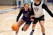 St. Thomas guard Maggie Negaard, left, leads the Tommies in scoring at 12.8 points per game.