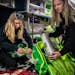 EMTs Elise Braswell and Brooke Yennie work with paramedic John Fox to inventory supplies on an ambulance at the Dodge Center Ambulance Service in Dodg