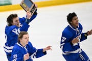 Minnetonka players, from left, Liam Hupka, Ashton Schultz and Javon Moore celebrated the 2-1 double-overtime victory Thursday against Chanhassen that 