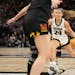 Iowa guard Gabbie Marshall (24) drove to the basket against Maryland in Saturday’s Big Ten semifinals at Target Center.