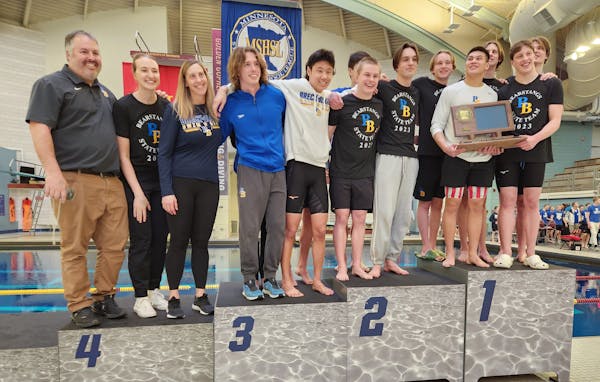 The Breck/Blake swimmers and coaches gathered on the medal stand Saturday.
