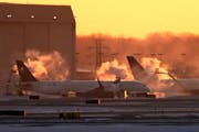 Delta plans get de-iced at Minneapolis-St. Paul International Airport, which received top honors from a trade group for customer satisfaction.