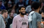 Karl-Anthony Towns was on the bench but not in uniform when the Timberwolves played on Saturday night in Sacramento.