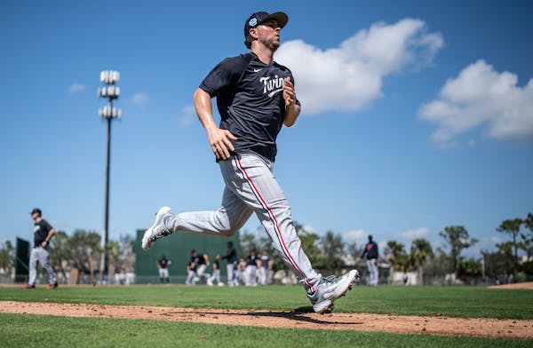 Kyle Farmer ran through drills at Twins spring training in Fort Myers, Fla.