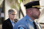Hennepin County Attorney Mary Moriarty listened to Minneapolis Police Chief Brian O’Hara at a news conference in January.