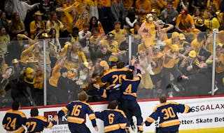 As one fan tried to join the celebration on the ice, Mahtomedi’s players met their supporters at the glass to celebrate the Zephyrs’ state champio