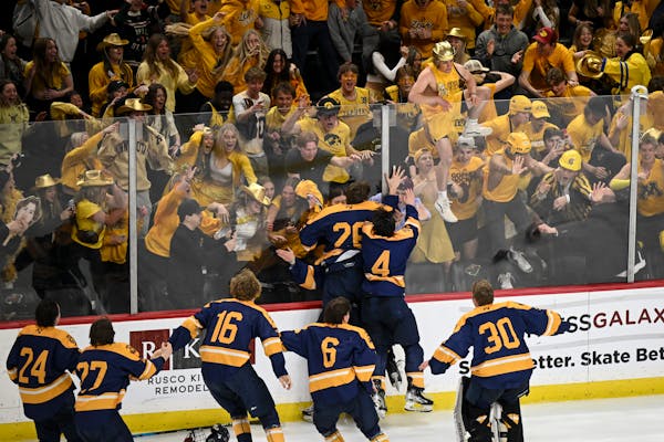 As one fan tried to join the celebration on the ice, Mahtomedi’s players met their supporters at the glass to celebrate the Zephyrs’ state champio