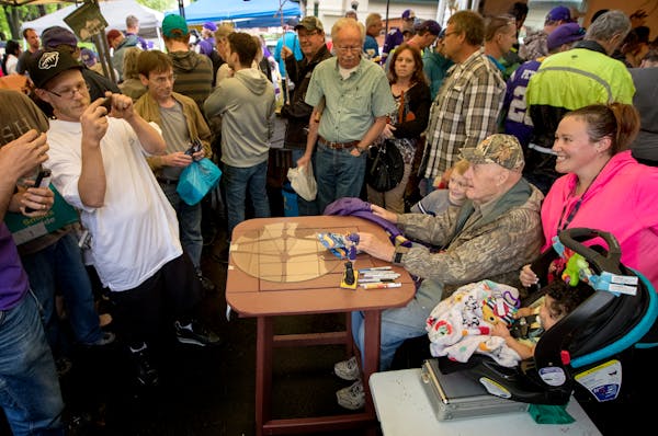 Bud Grant posed for a photo during his annual garage sale in 2017.